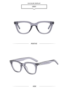 Detail of grey polygon sunglasses featuring metallic star ornaments on the temples
