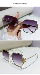 Detail of metal square frame sunglasses with golden hollow star decor and gradient lenses