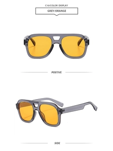 Detail of grey pilot sunglasses with orange lenses showing front and side views