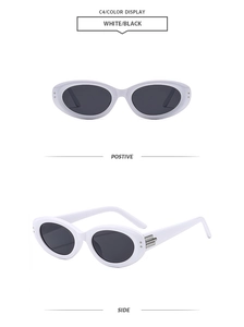 Detail view of oval white sunglasses with black lenses and metallic temple accents