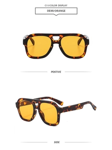 Detail view of demi frames with orange lenses on retro double bridge aviator sunglasses