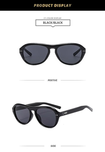 Détail des lunettes pilote C1 noires avec décorations métalliques argentées sur les branches
