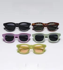 Multiple colors of retro oval thick frame sunglasses arranged in a neat triangle display