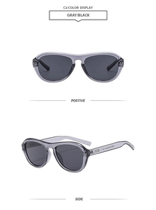 Détails des lunettes aviateur grises avec rivets argentés et verres noirs fumés
