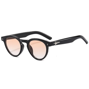 Black round frame sunglasses with gradient orange lenses and silver star metal accents