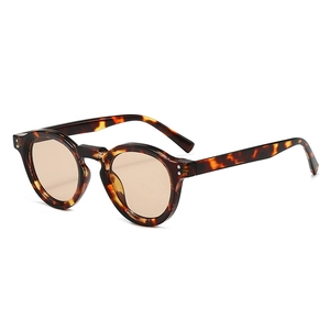 Classic round tortoiseshell sunglasses with amber lenses and stylish silver metal rivets