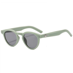 Retro round mint green sunglasses with dark grey lenses and silver star metal accents