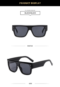 Fashionable square large frame sunglasses with metal stud details and black lenses