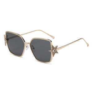 Vintage oversized square sunglasses with gold metal frames and star decorative details