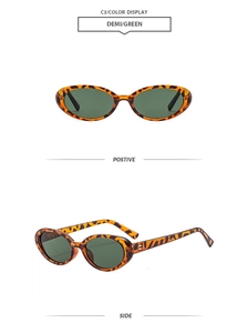 Detail of retro oval tortoiseshell sunglasses with green lenses and sturdy metal hinges
