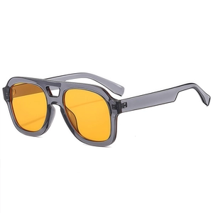 Retro pilot sunglasses with grey translucent frame and vibrant orange lenses