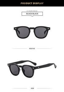Detail view of retro black square sunglasses with silver arrow rivets and dark lenses