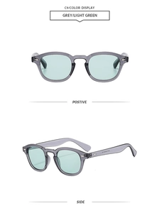 Detail view of grey translucent retro sunglasses featuring silver diamond-shaped rivets