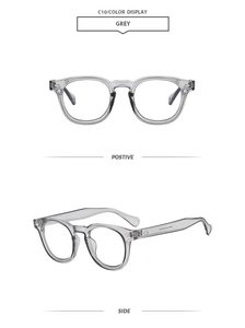 Front and side view of transparent grey round sunglasses with metal rivet details