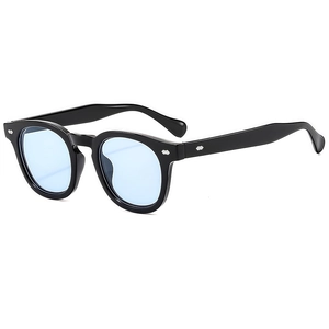 Retro black frame sunglasses with light blue lenses and silver diamond rivets on a white background