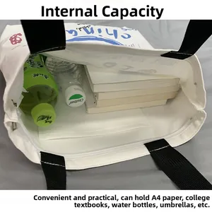 Internal view of large white canvas tote bag showing capacity for A4 books and water bottle