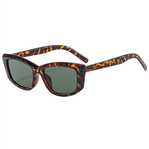 Classic tortoise shell square sunglasses with dark green lenses in retro cat-eye style