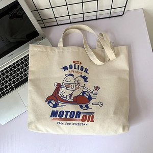 Detail of a beige canvas tote bag with vintage American cartoon print and durable texture