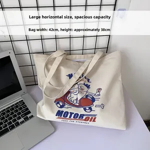 Canvas tote bag with motor oil graphic showing 42cm width and 38cm height details