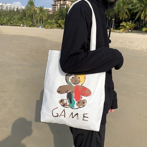Sac fourre-tout en toile blanche avec motif d'ours coloré et lettrage GAME