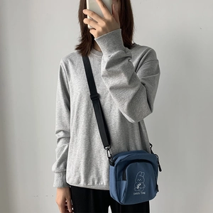 Blue canvas crossbody bag featuring a cute cartoon rabbit print and snack time text