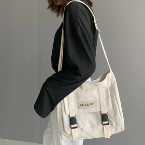 Minimalist beige waterproof nylon crossbody bag with large capacity and buckle closure