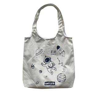 Minimalist canvas tote bag with space theme astronaut and UFO graphic illustration
