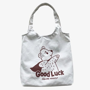Japanese style white canvas tote bag with bear illustration and Good Luck print
