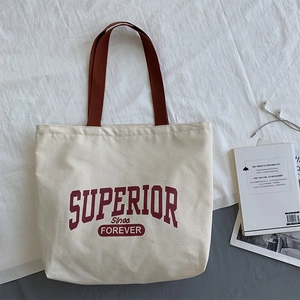 Retro canvas tote bag with red letter print and brown straps for daily travel