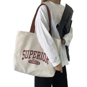 Retro canvas tote bag with red Superior lettering and brown shoulder straps