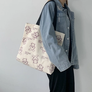 White canvas tote bag with cute purple bear print and black shoulder strap for women