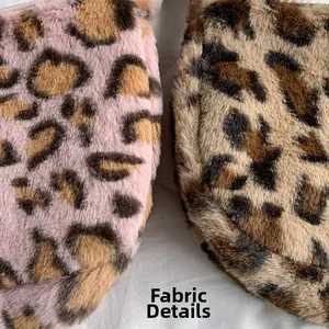 Close-up of leopard print faux fur fabric showing soft plush texture in pink and brown