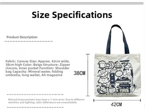 Detail view of beige canvas tote bag with cartoon illustrations showing 42x38cm dimensions