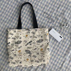 Large capacity canvas tote bag with comic graffiti prints and black shoulder straps