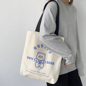 Borsa tote in tela bianco avorio minimalista con stampa orsetto e manici neri