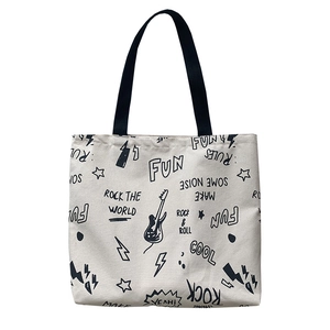 Grand sac cabas en toile blanc cassé avec imprimés graffiti rock et bandoulières noires