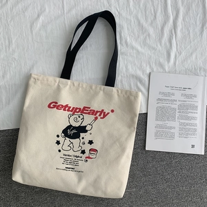 Japanese style canvas tote bag with GetupEarly cartoon bear print and black handles