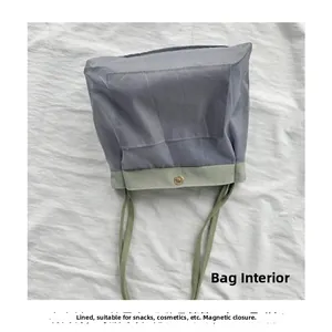 Close-up of nylon bag interior with magnetic closure and lined storage for cosmetics