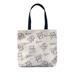 Japanese style cream canvas tote bag with purple teddy bear print and black straps