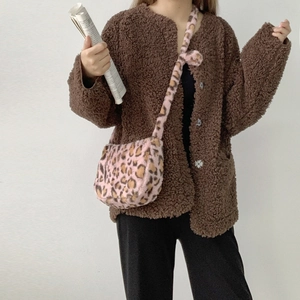 Detail view of the pink leopard print plush crossbody bag with soft faux fur texture