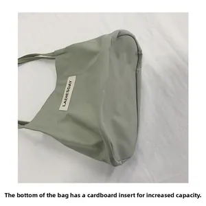 Detail of the reinforced base board providing a large cubic capacity for the tote bag