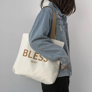 Borsa tote minimalista in tela con spalline marroni e stampa BLESS REAP sulla spalla