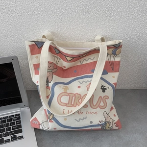 Detail of circus theme canvas tote bag with red stripes and secure zipper closure