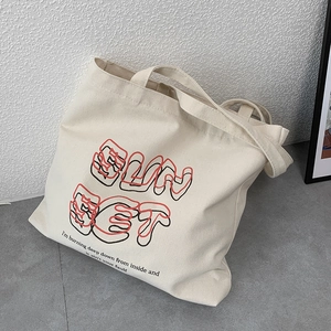 Minimalist beige canvas tote bag with SunSet artistic text and retro American style