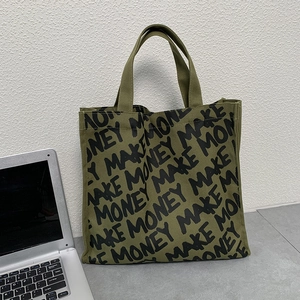 Army green canvas tote bag featuring black MAKE MONEY print in a street style design