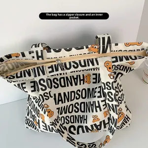 Detail of canvas tote bag showing top zipper closure and functional inner pocket
