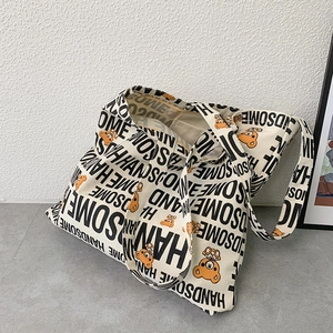 Minimalist cream canvas tote bag with handsome letters and orange bear patterns