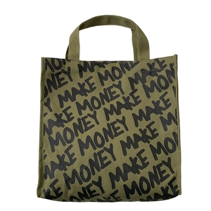 Army green canvas tote bag with black Make Money print in a minimalist street style