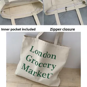 Detail view of cream canvas tote bag showing secure metal zipper and interior pocket