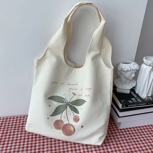 Artistic canvas tote bag with red cherry illustration and hand-written typography